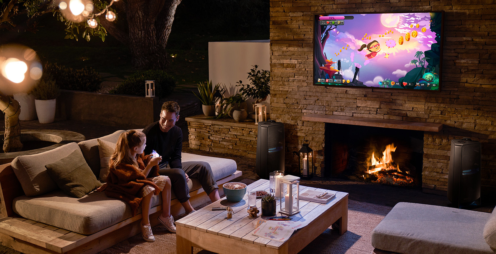 outdoor garden entertainment area with tv and sofa