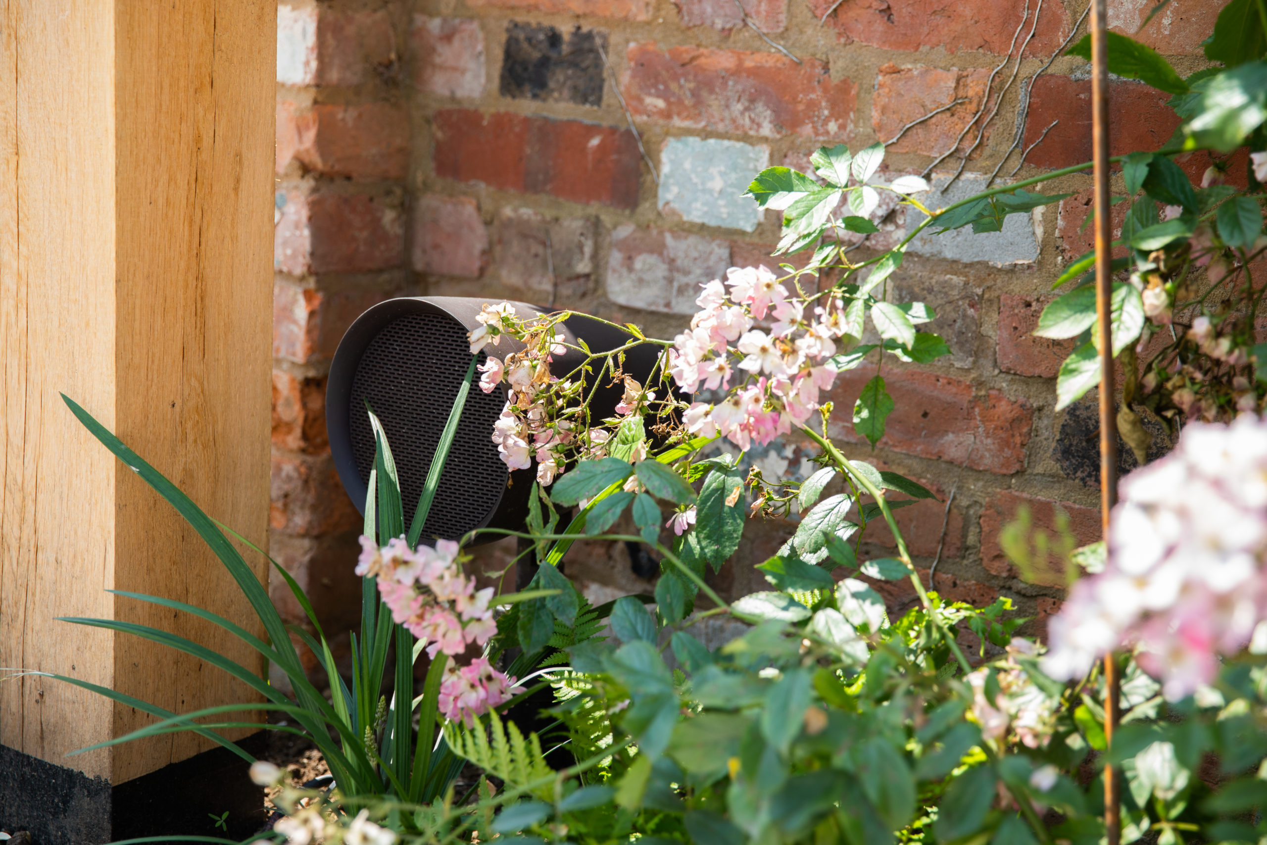 hidden outdoor speaker in flower bed