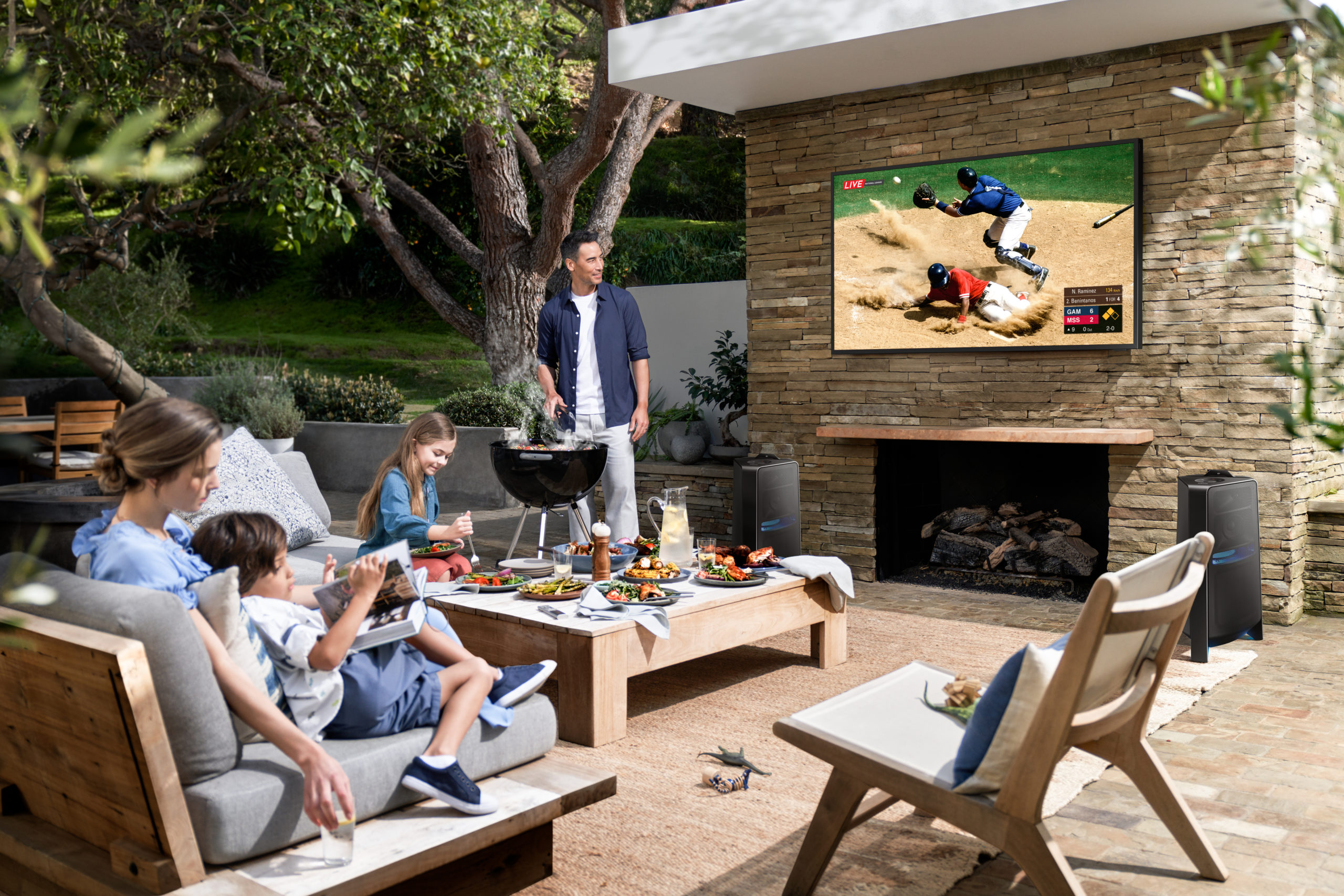 family playing a game and laughing in outdoor entertainment area