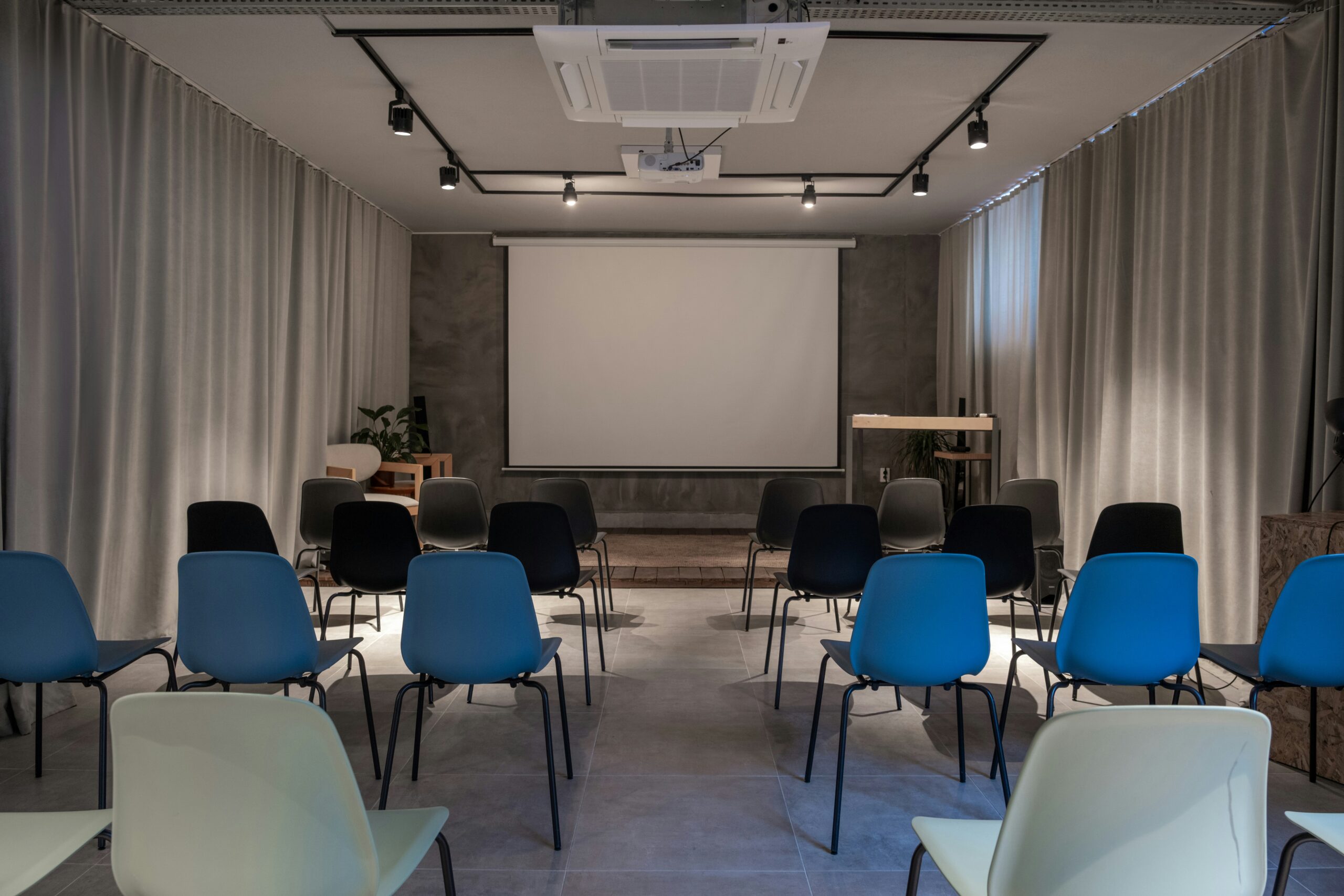 office room with interactive screen, speakers and lighting
